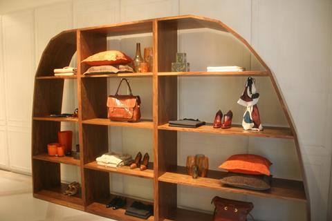 Every part of the shopfit is bespoke, with a distinct, minimalist feel. Stock is elegantly displayed on single rails, while an open-fronted curved wooden bookcase is a stand out.